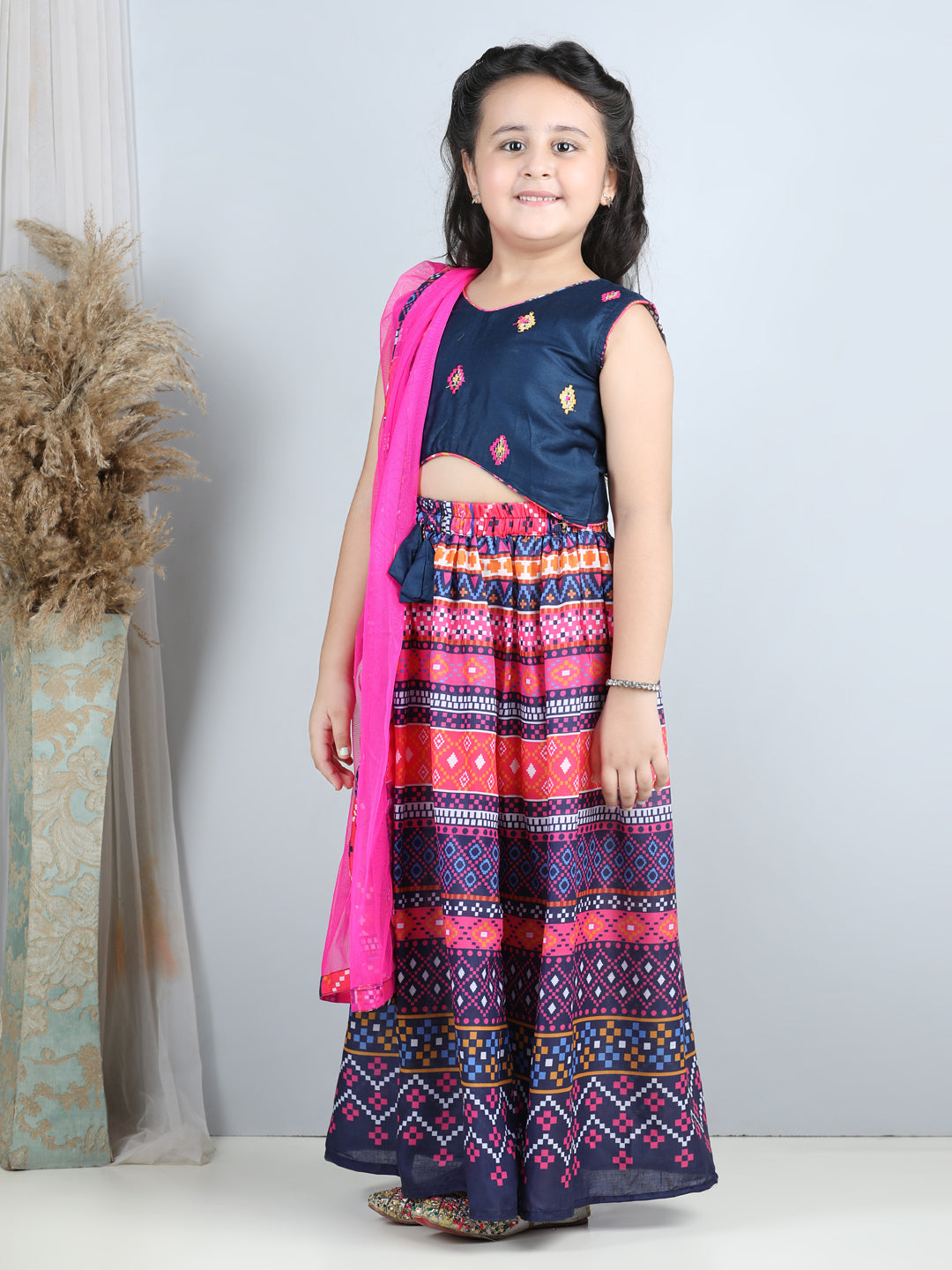Embroidered Top with printed blue lehenga and dupatta