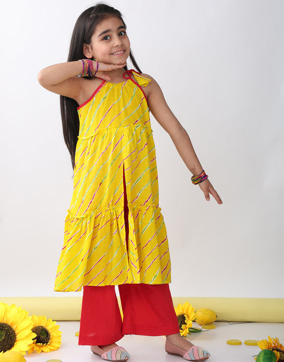 Yellow sleeveless lehriya Kurti with red pant