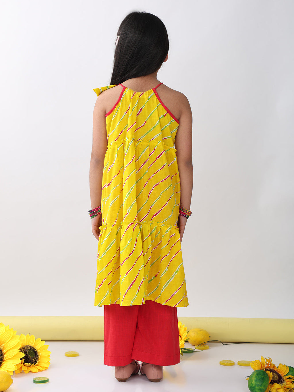 Yellow sleeveless lehriya Kurti with red pant