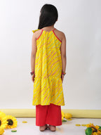 Yellow sleeveless lehriya Kurti with red pant