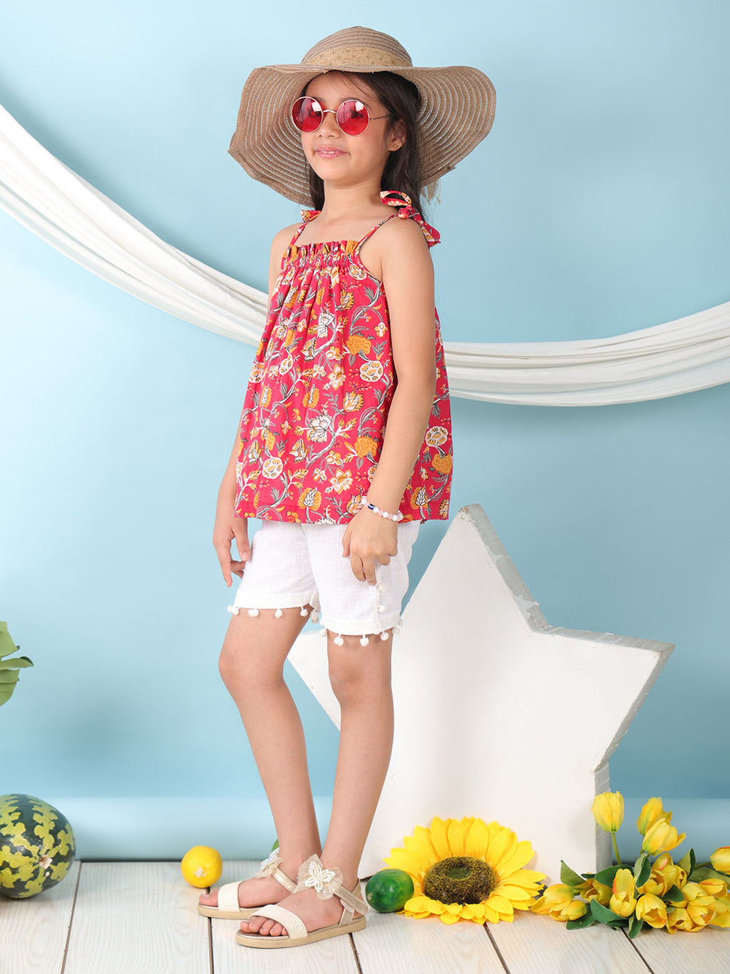 Red sleeveless Top with white short pant