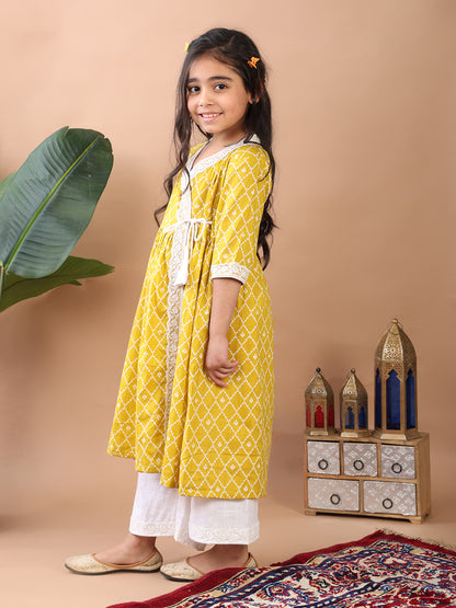 Yellow Angrakha Kurti  paired with white Plazo pant