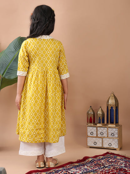 Yellow Angrakha Kurti  paired with white Plazo pant