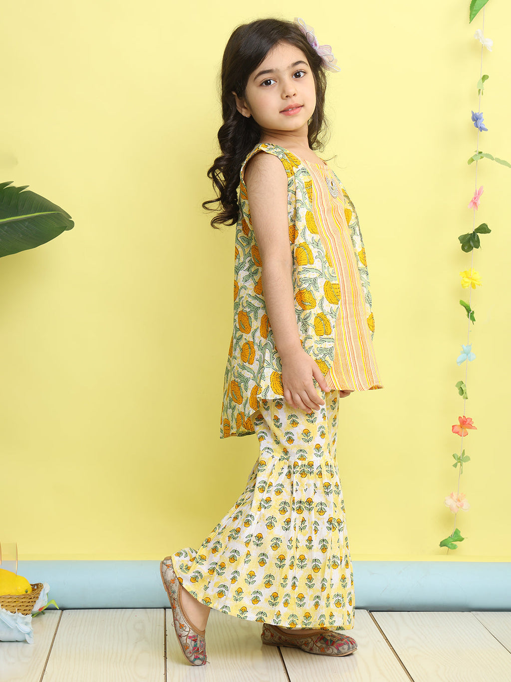 Yellow stripped sleeveless kurti with Floral sharara and jacket