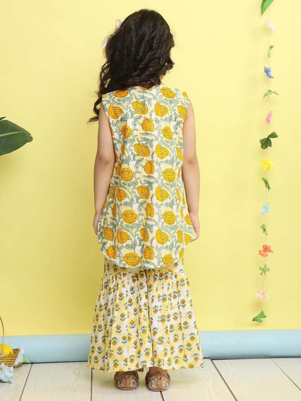 Yellow stripped sleeveless kurti with Floral sharara and jacket