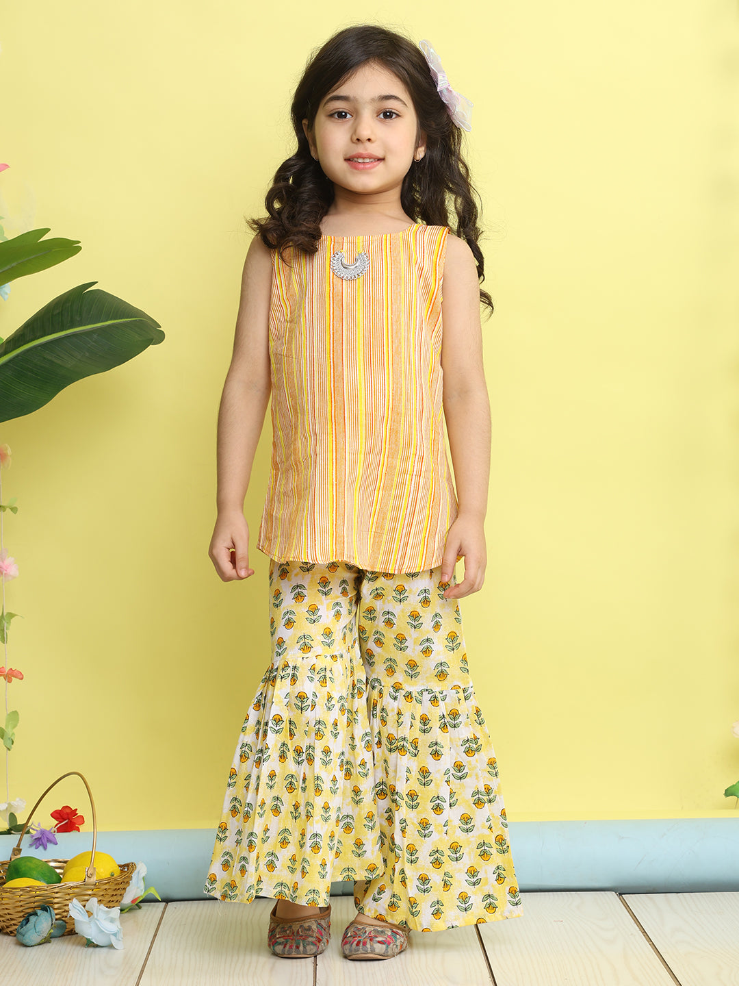 Yellow stripped sleeveless kurti with Floral sharara and jacket