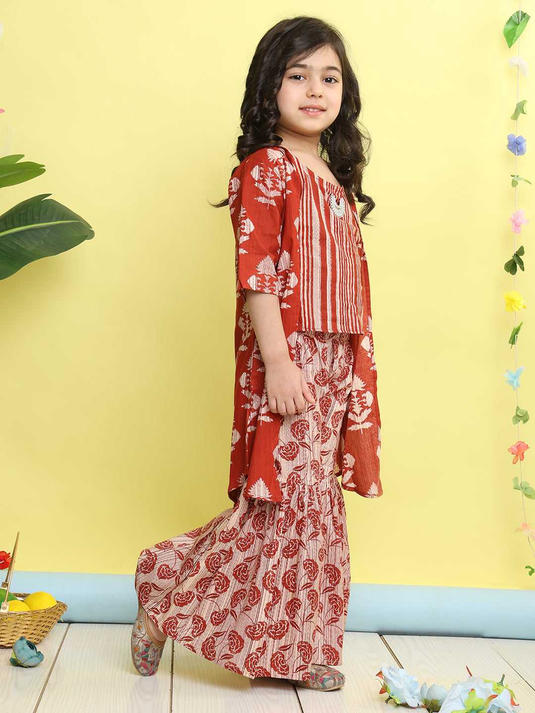 Red stripped sleeveless top with Floral sharara and jacket