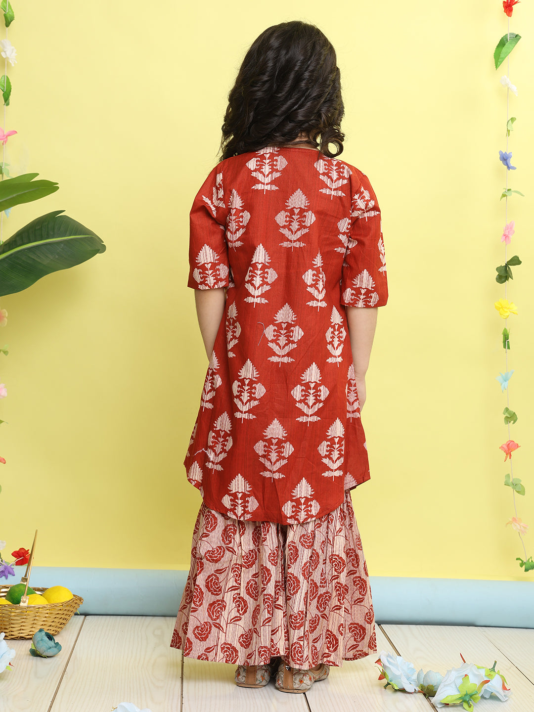 Red stripped sleeveless top with Floral sharara and jacket