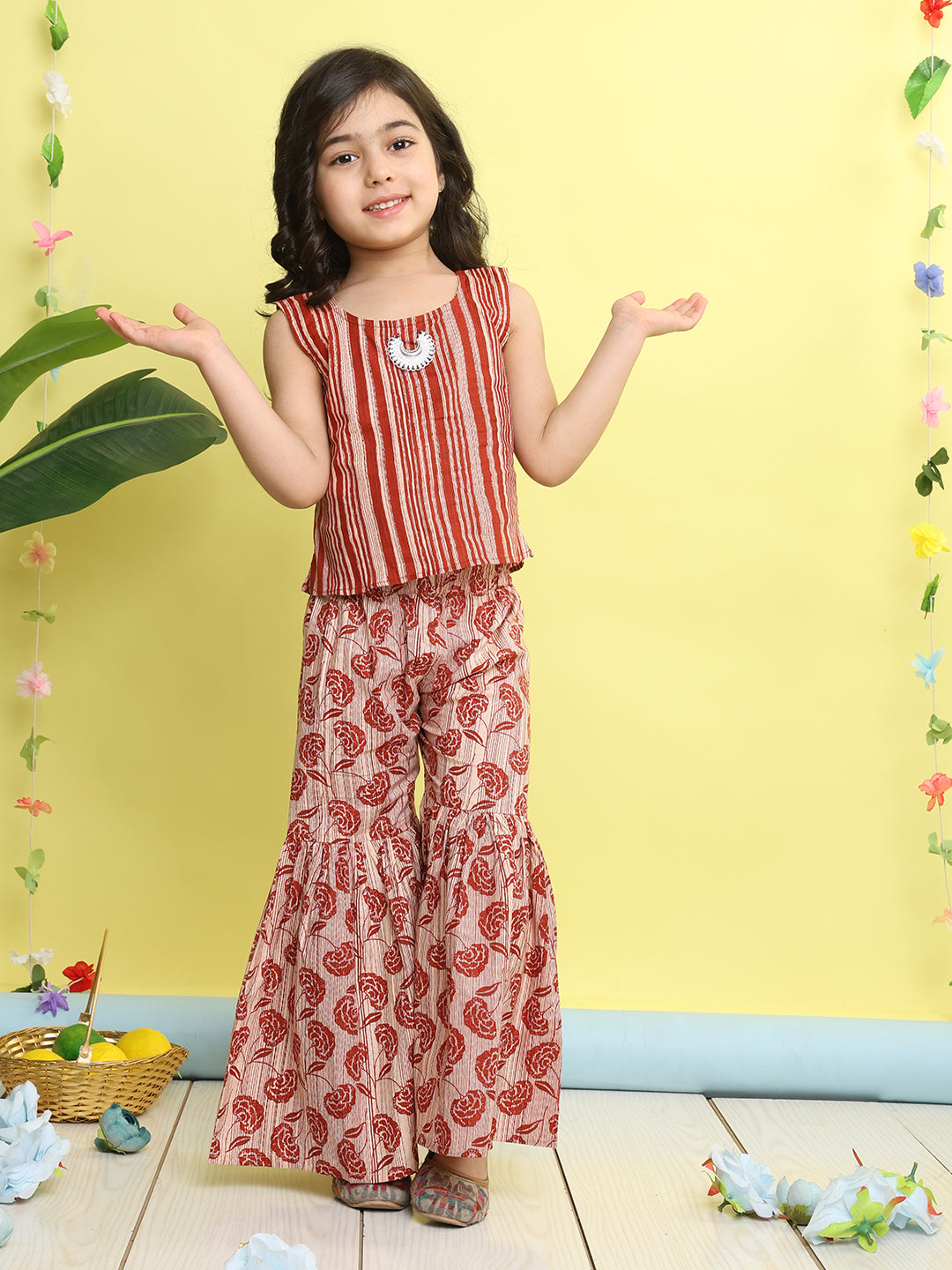 Red stripped sleeveless top with Floral sharara and jacket