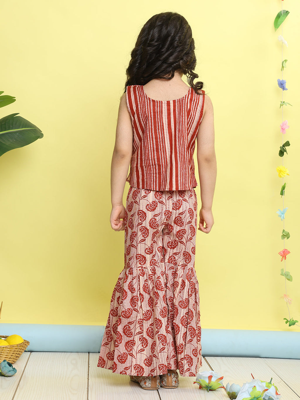 Red stripped sleeveless top with Floral sharara and jacket