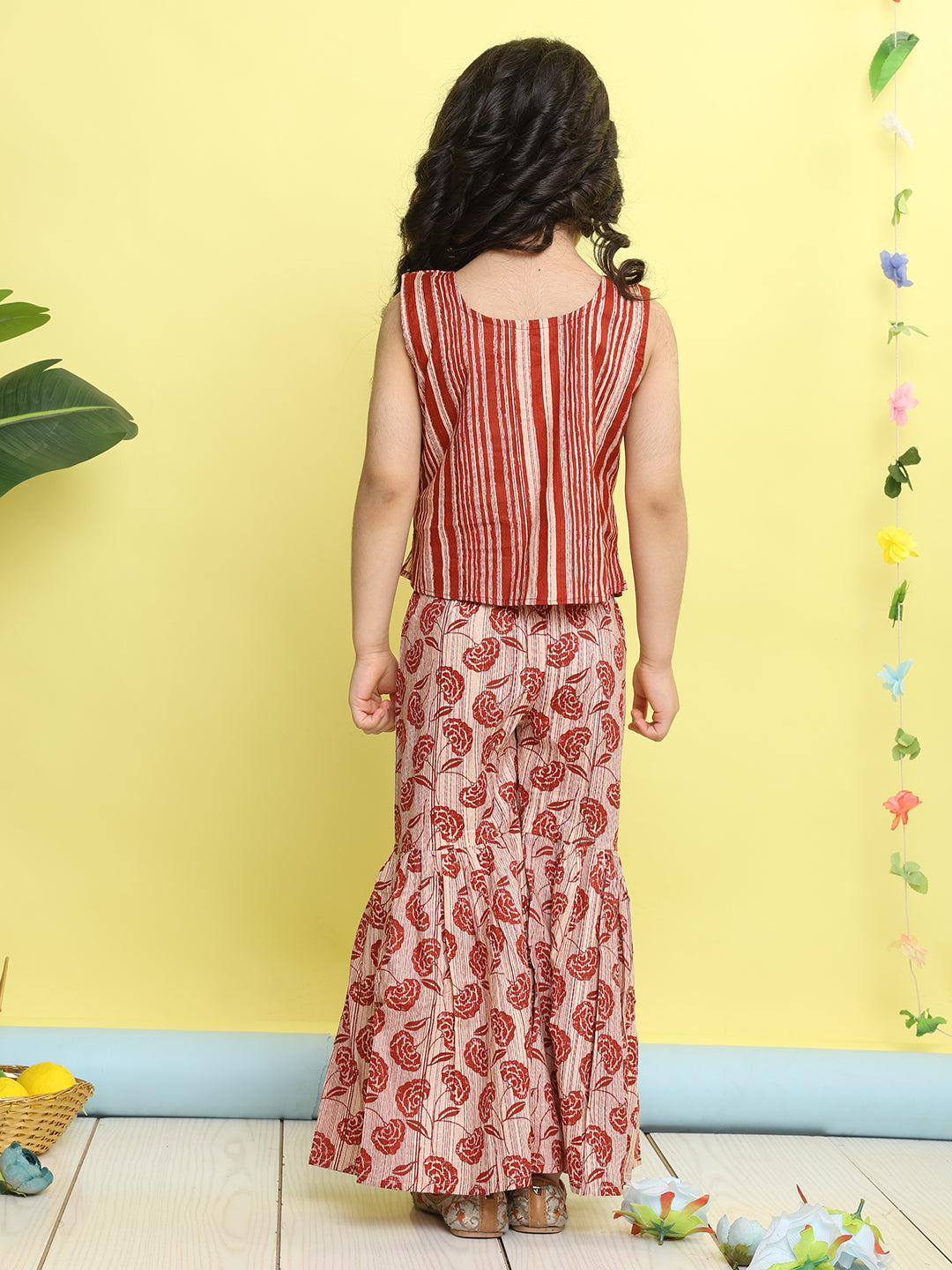 Red stripped sleeveless top with Floral sharara and jacket