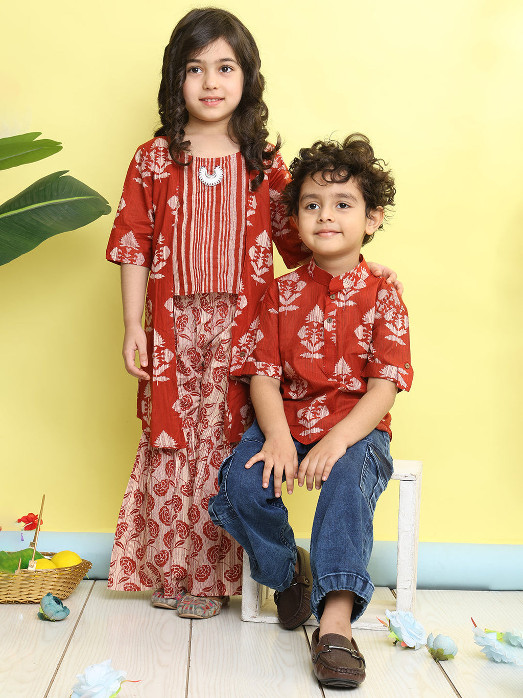 Red stripped sleeveless top with Floral sharara and jacket