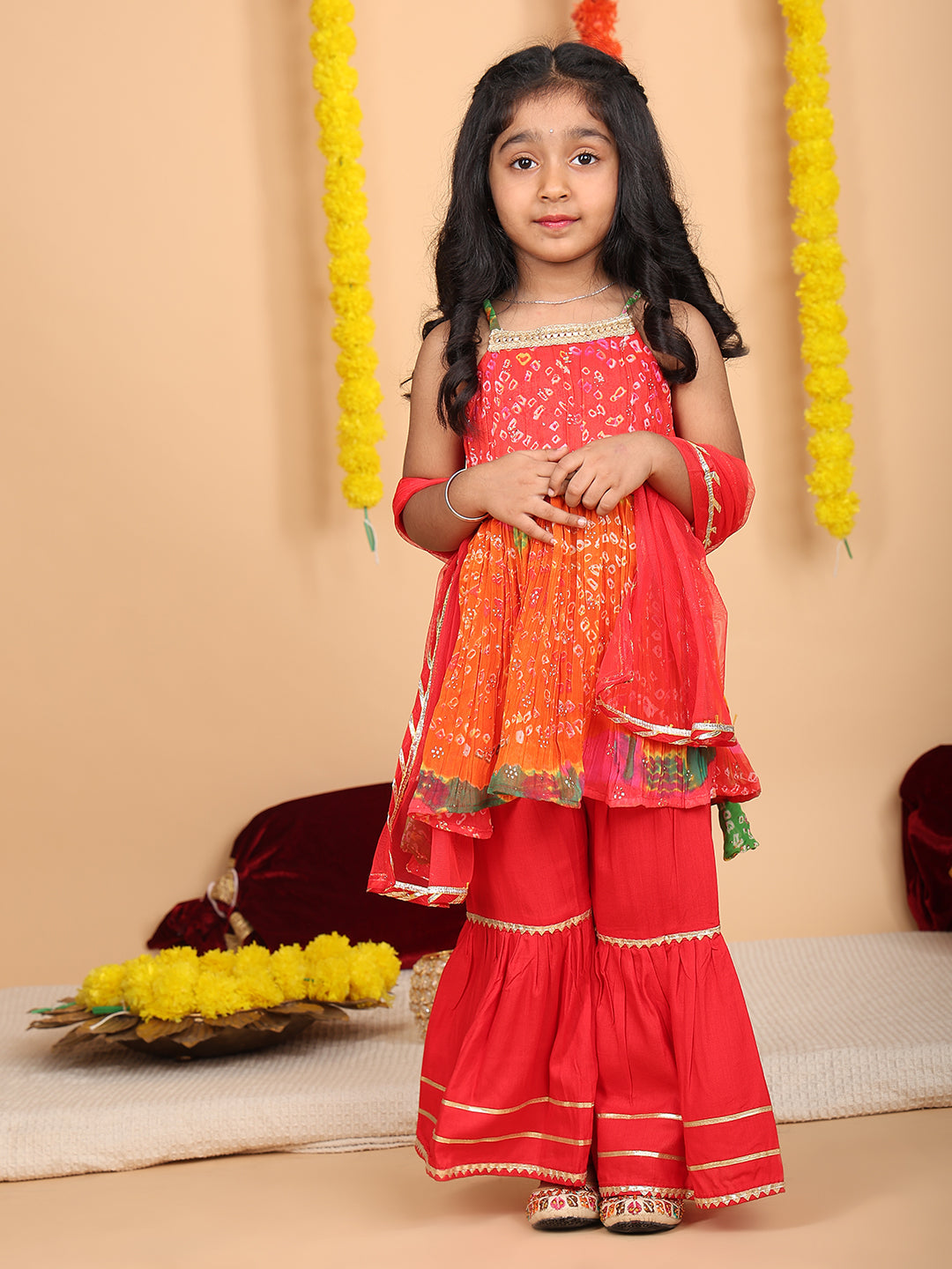 Red bandez printed Crushed sleeveless kurti with red sharara and dupatta
