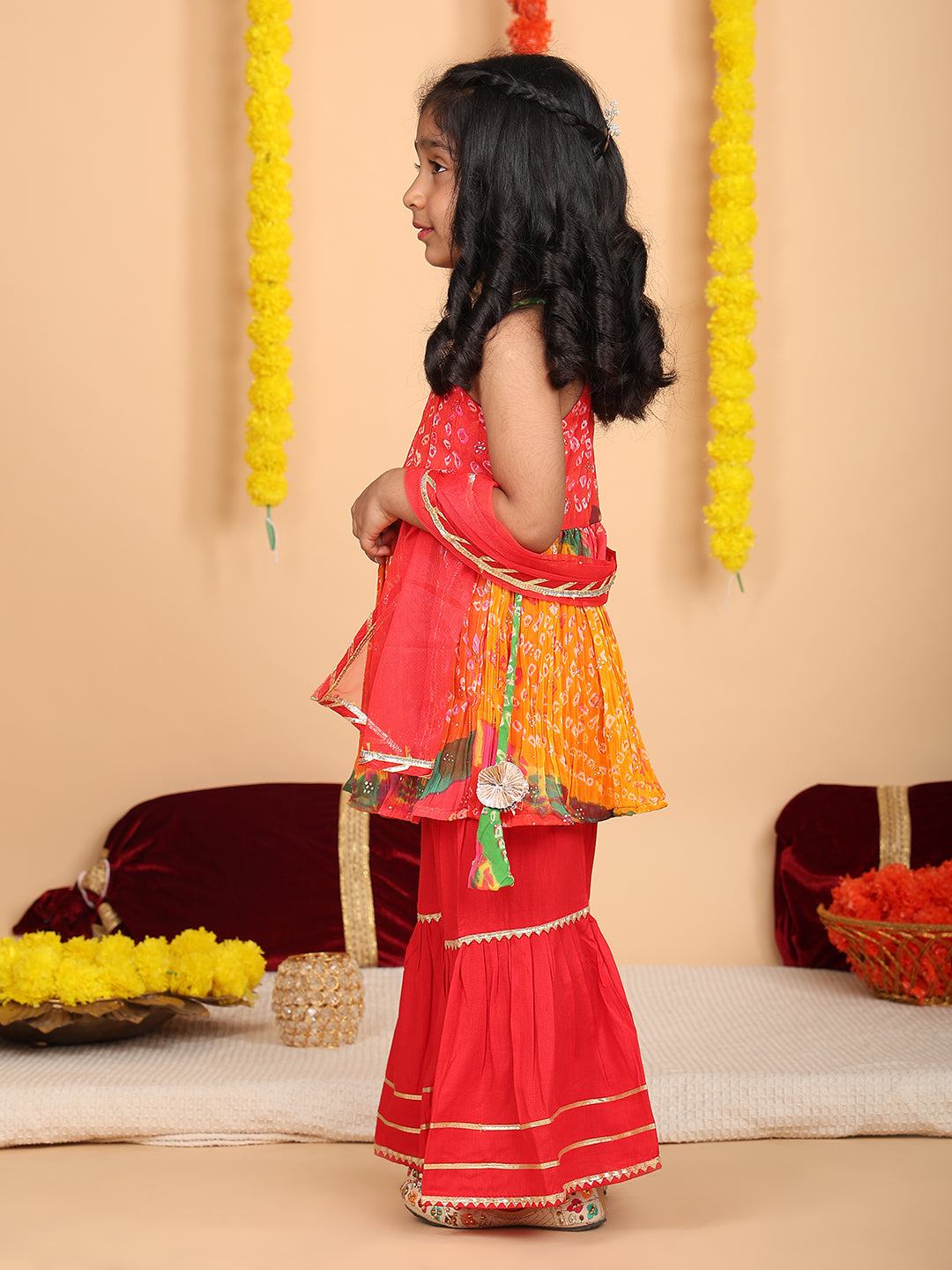 Red bandez printed Crushed sleeveless kurti with red sharara and dupatta