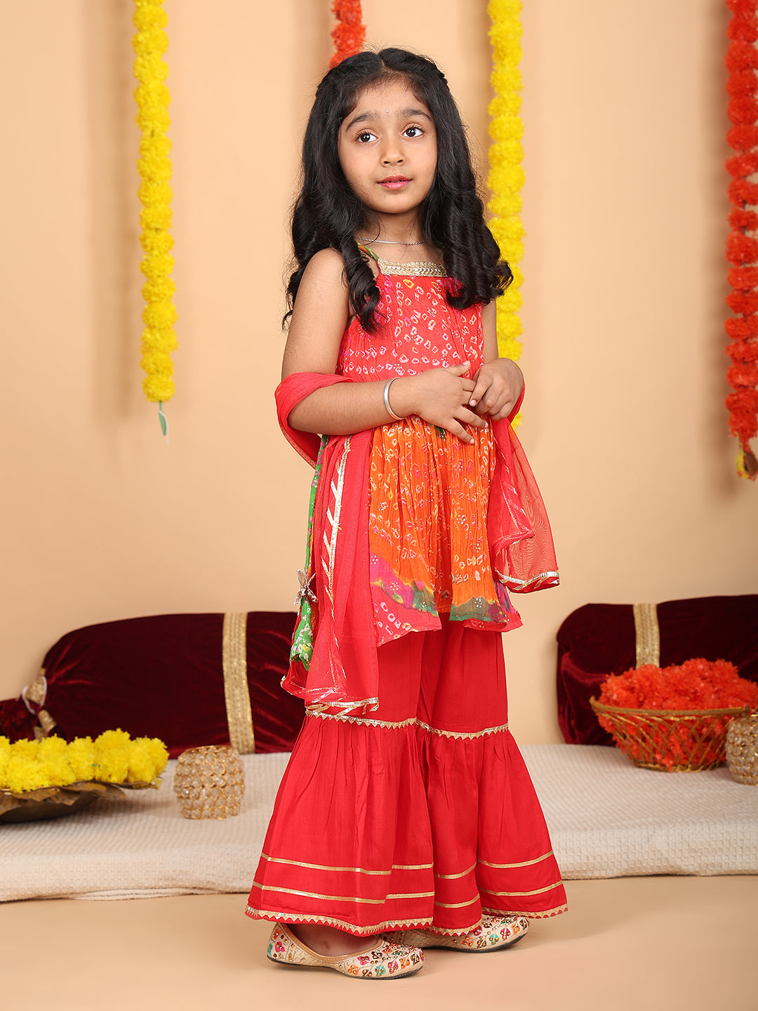Red bandez printed Crushed sleeveless kurti with red sharara and dupatta