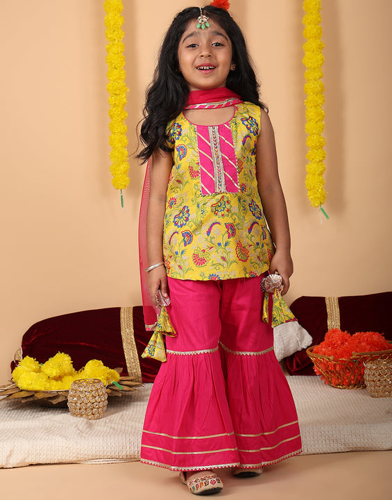 Yellow printed sleeveless kurti with Pink sharara and dupatta