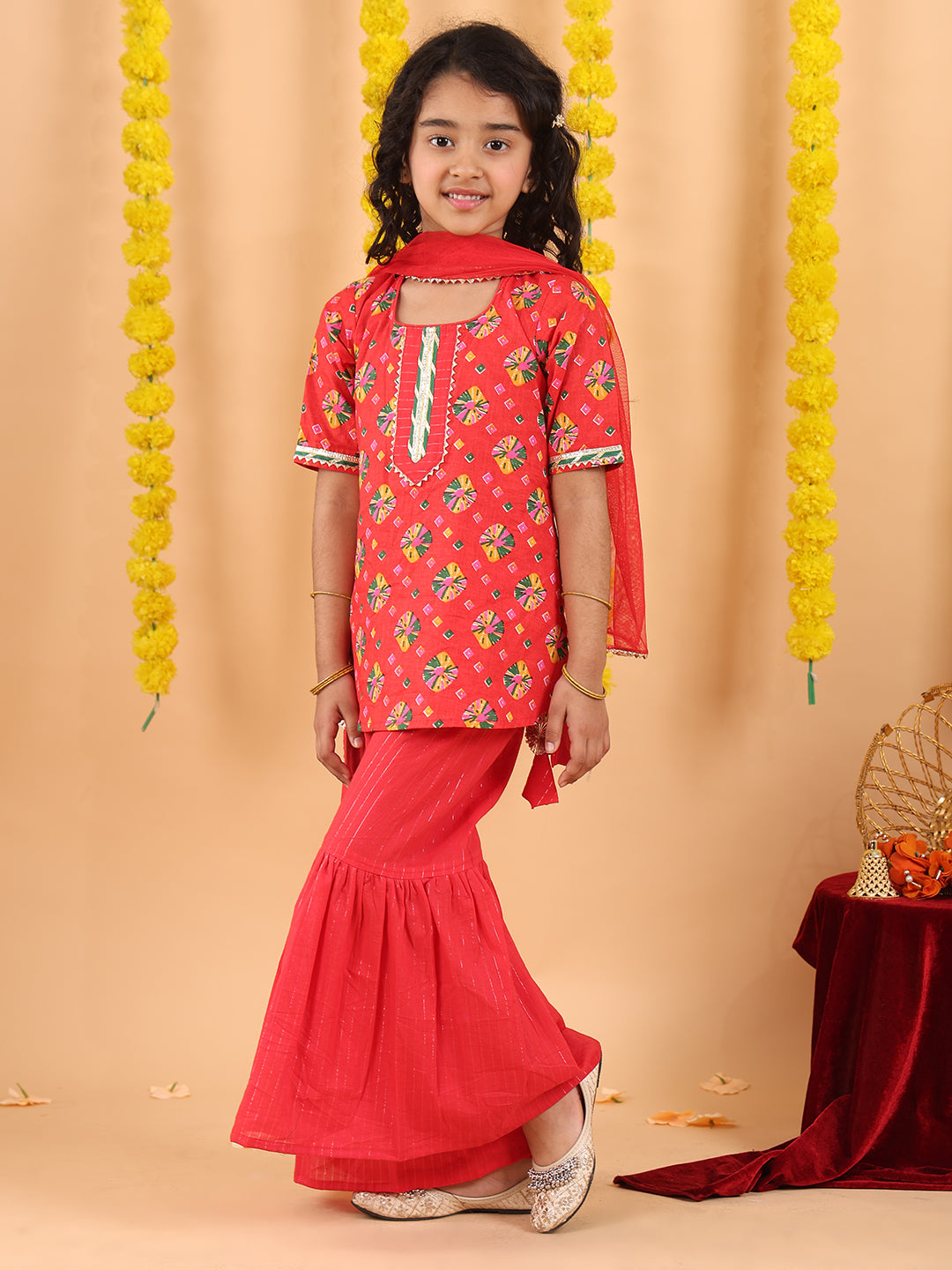 Red 3/4 sleeves printed Kurti with red Sharara pant and dupatta