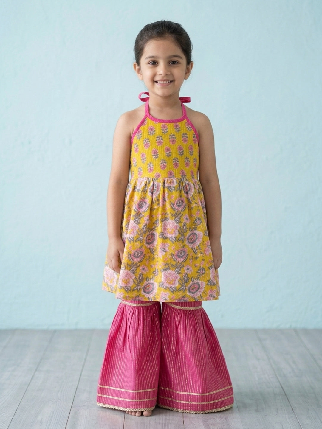 Yellow Floral Printed Halter Neck Sleeveless Kurti with pink Sharara