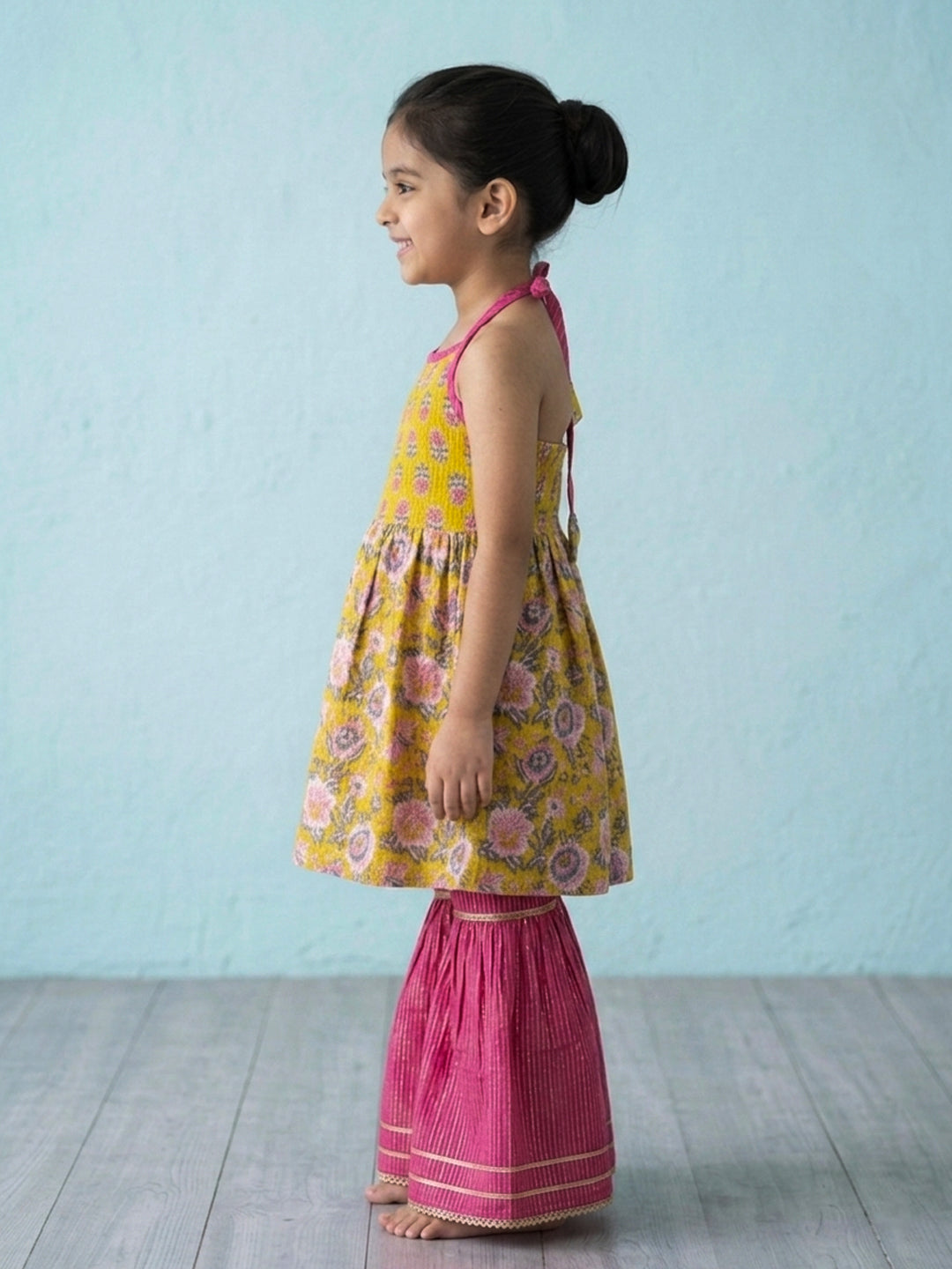 Yellow Floral Printed Halter Neck Sleeveless Kurti with pink Sharara