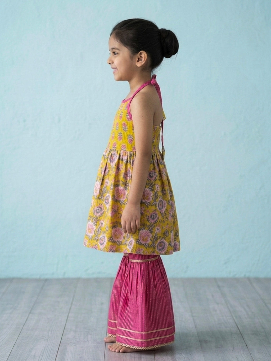 Yellow Floral Printed Halter Neck Sleeveless Kurti with pink Sharara