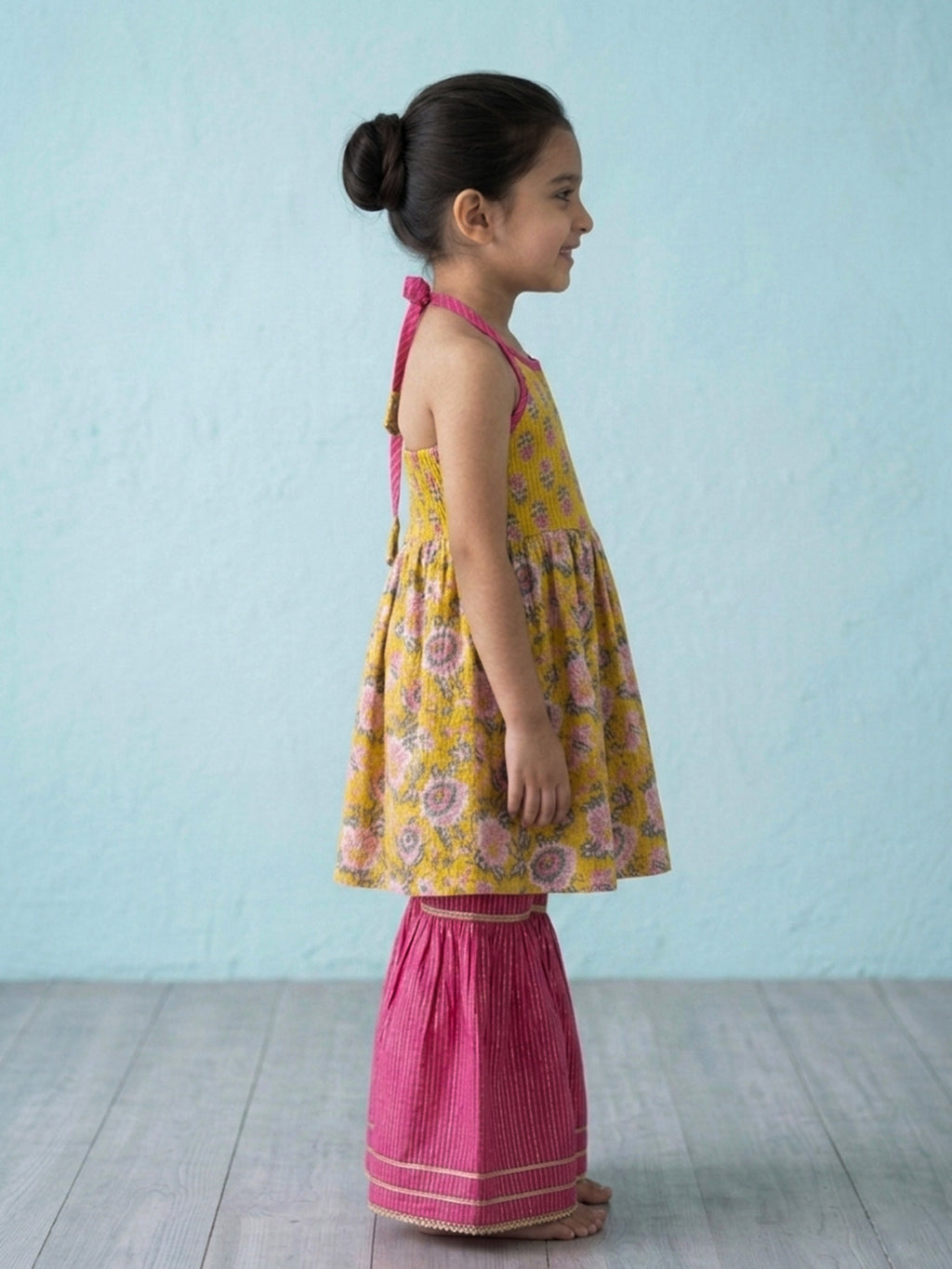 Yellow Floral Printed Halter Neck Sleeveless Kurti with pink Sharara