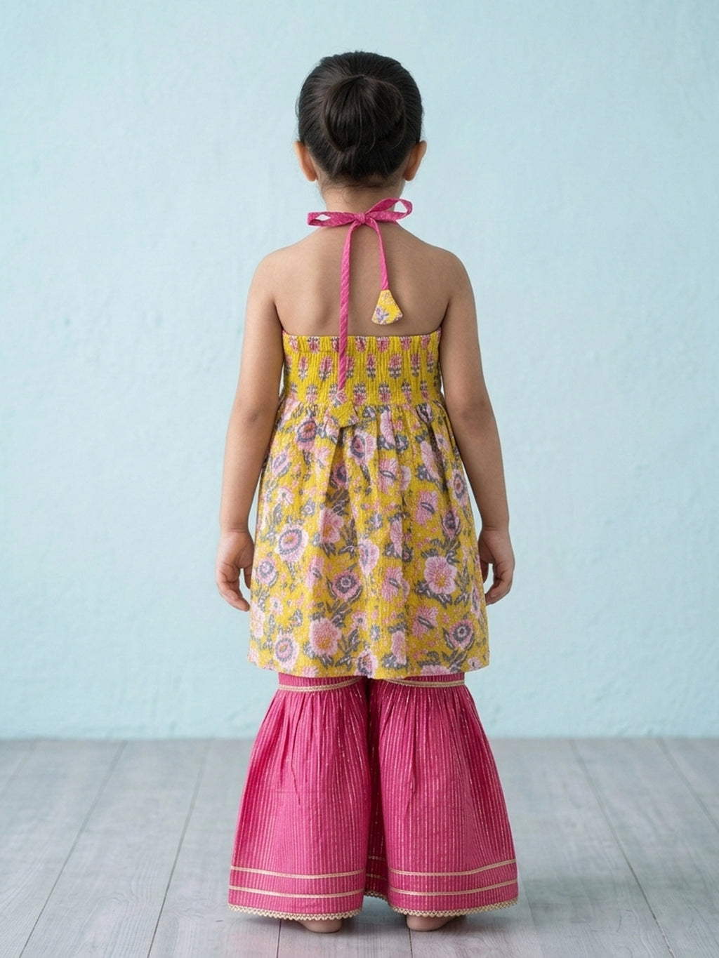 Yellow Floral Printed Halter Neck Sleeveless Kurti with pink Sharara