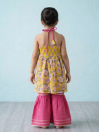 Yellow Floral Printed Halter Neck Sleeveless Kurti with pink Sharara