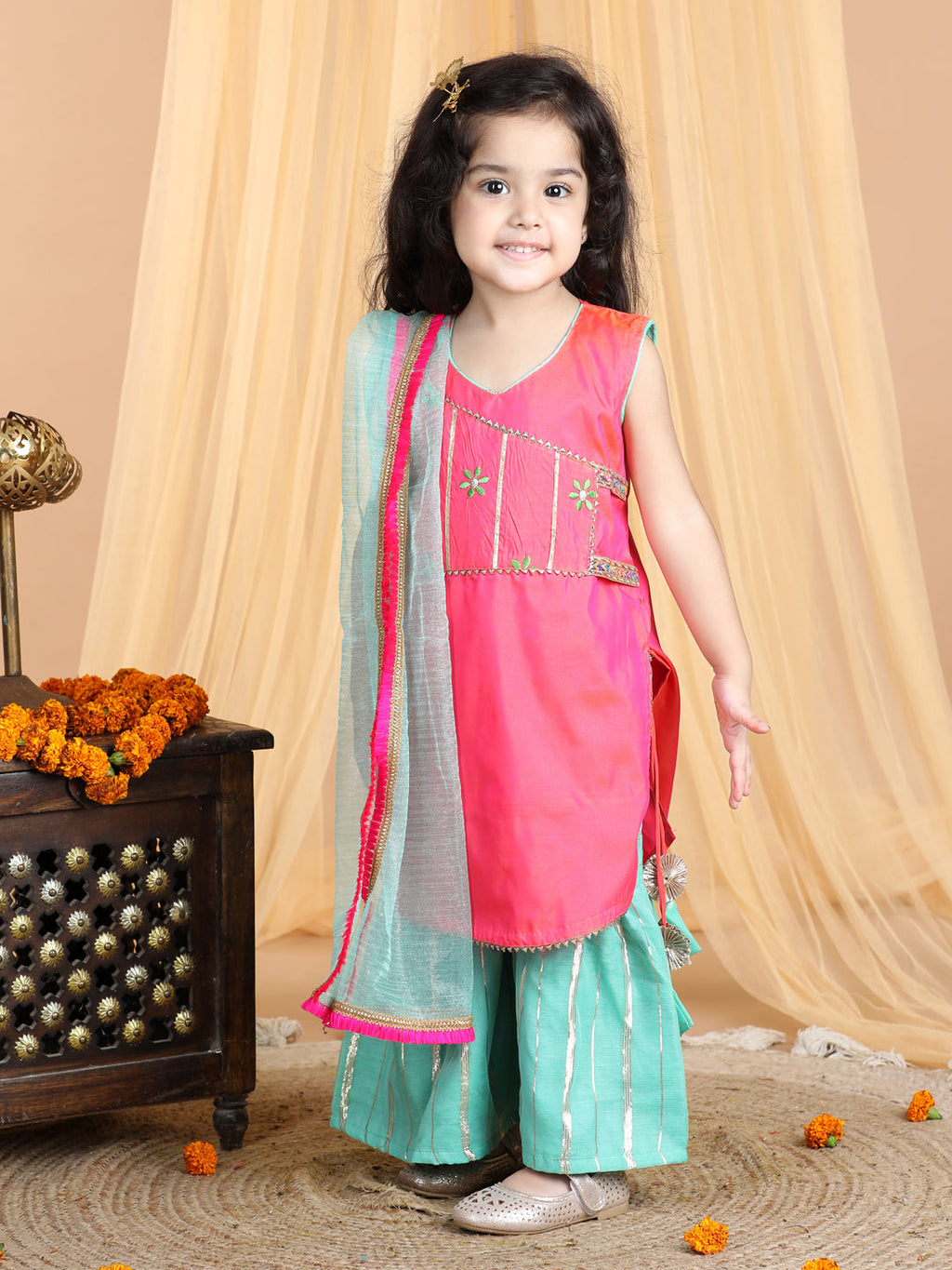 Pink embroidered Kurti paried with gold printed Sharara pant