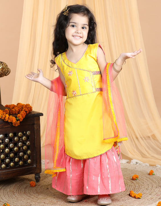 Yellow embroidered Kurti paried with gold printed Sharara pant