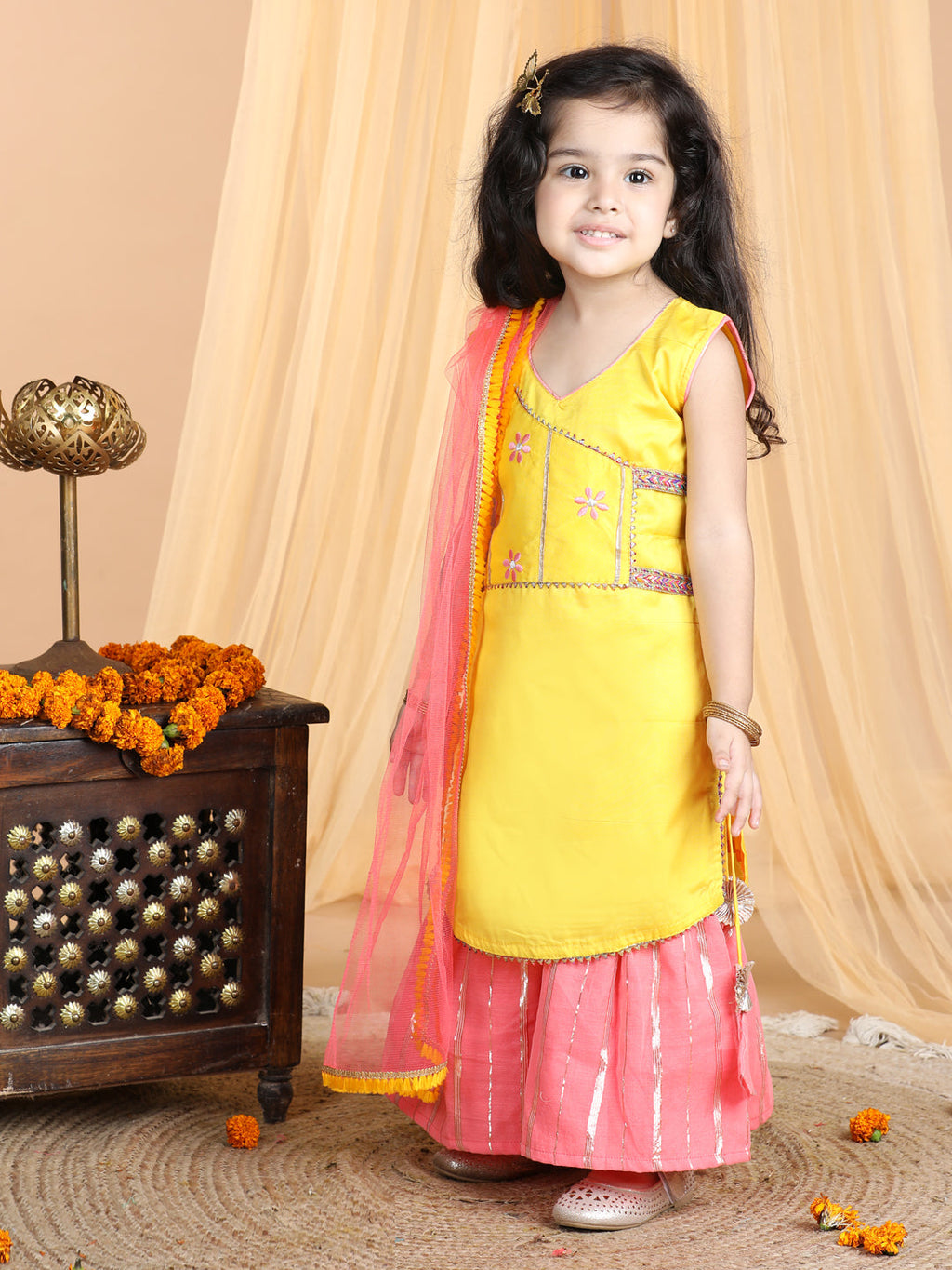 Yellow embroidered Kurti paried with gold printed Sharara pant