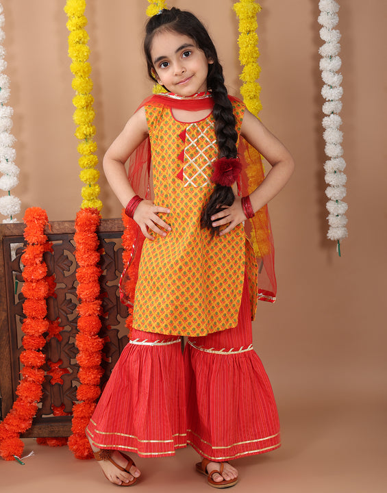 Yellow sleeveless cotton  kurti with Red sharara pant and dupatta