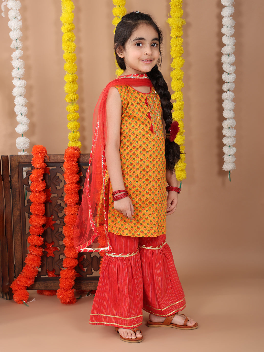 Yellow sleeveless cotton  kurti with Red sharara pant and dupatta