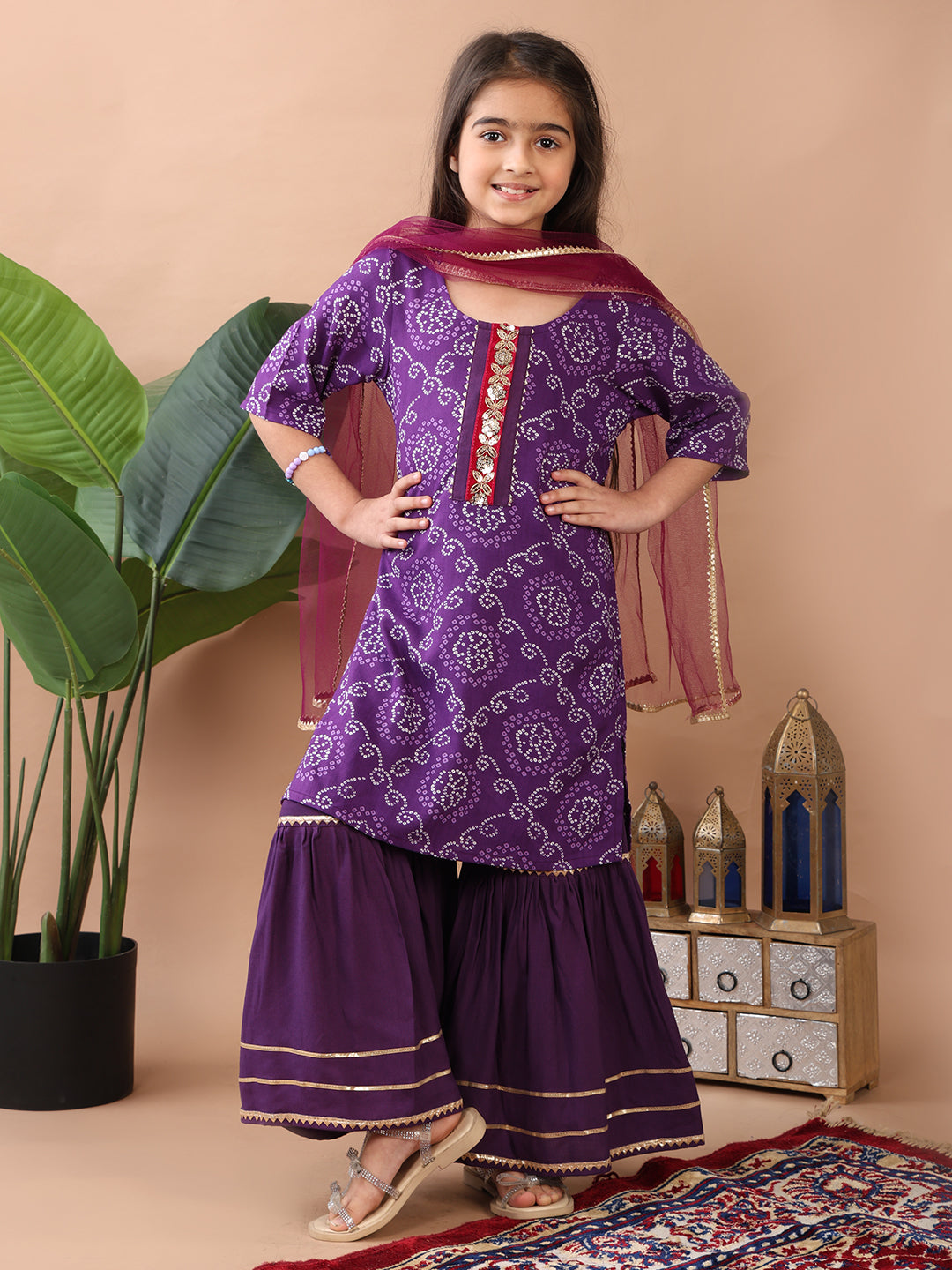 Purple kurti  paired with sharara and dupatta