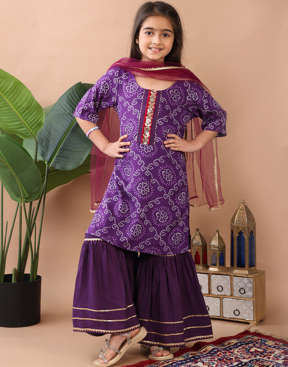 Purple kurti  paired with sharara and dupatta