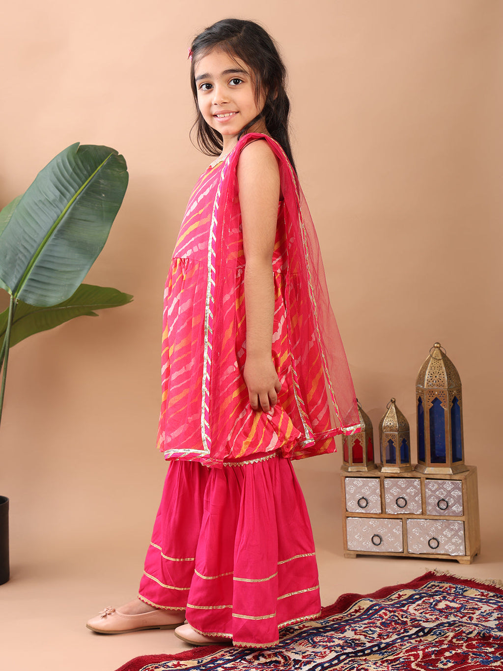 Pink Lehriya printed sleeveless Kurti  paired with pink sharara pant and dupatta