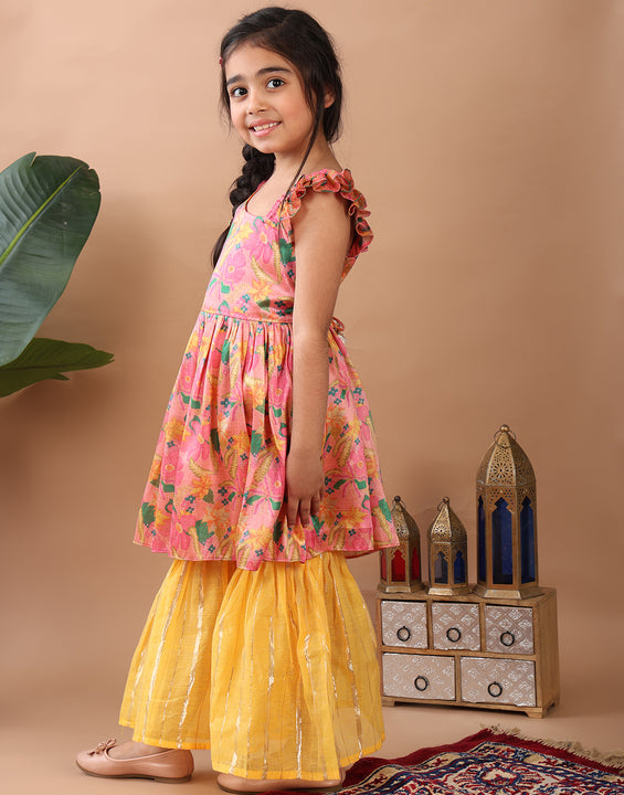 Pink Floral  printed sleeveless Kurti  paired with Yellow Lurex sharara pant and dupatta