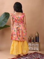 Pink Floral  printed sleeveless Kurti  paired with Yellow Lurex sharara pant and dupatta