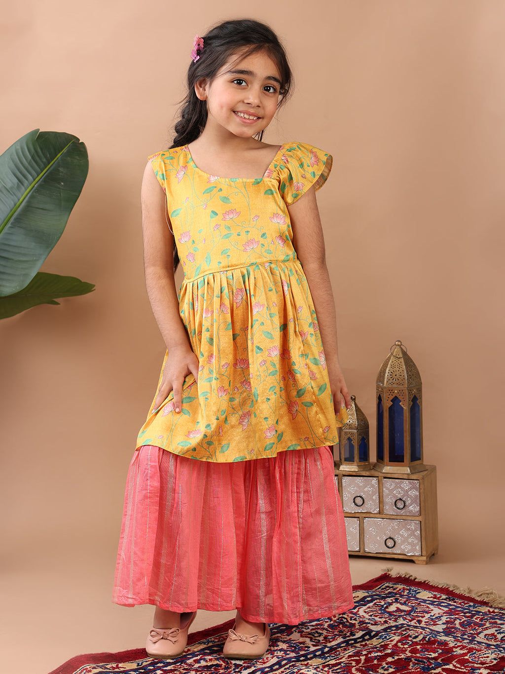 Yellow Lotus printed sleeveless Kurti  paired with pink Lurex sharara pant and dupatta