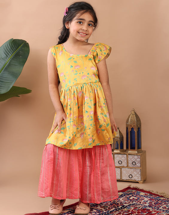 Yellow Lotus printed sleeveless Kurti  paired with pink Lurex sharara pant and dupatta