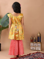 Yellow Lotus printed sleeveless Kurti  paired with pink Lurex sharara pant and dupatta