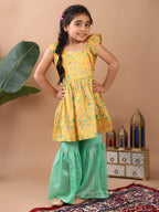 Yellow Lotus  printed sleeveless Kurti  paired with Green lurex sharara pant and dupatta