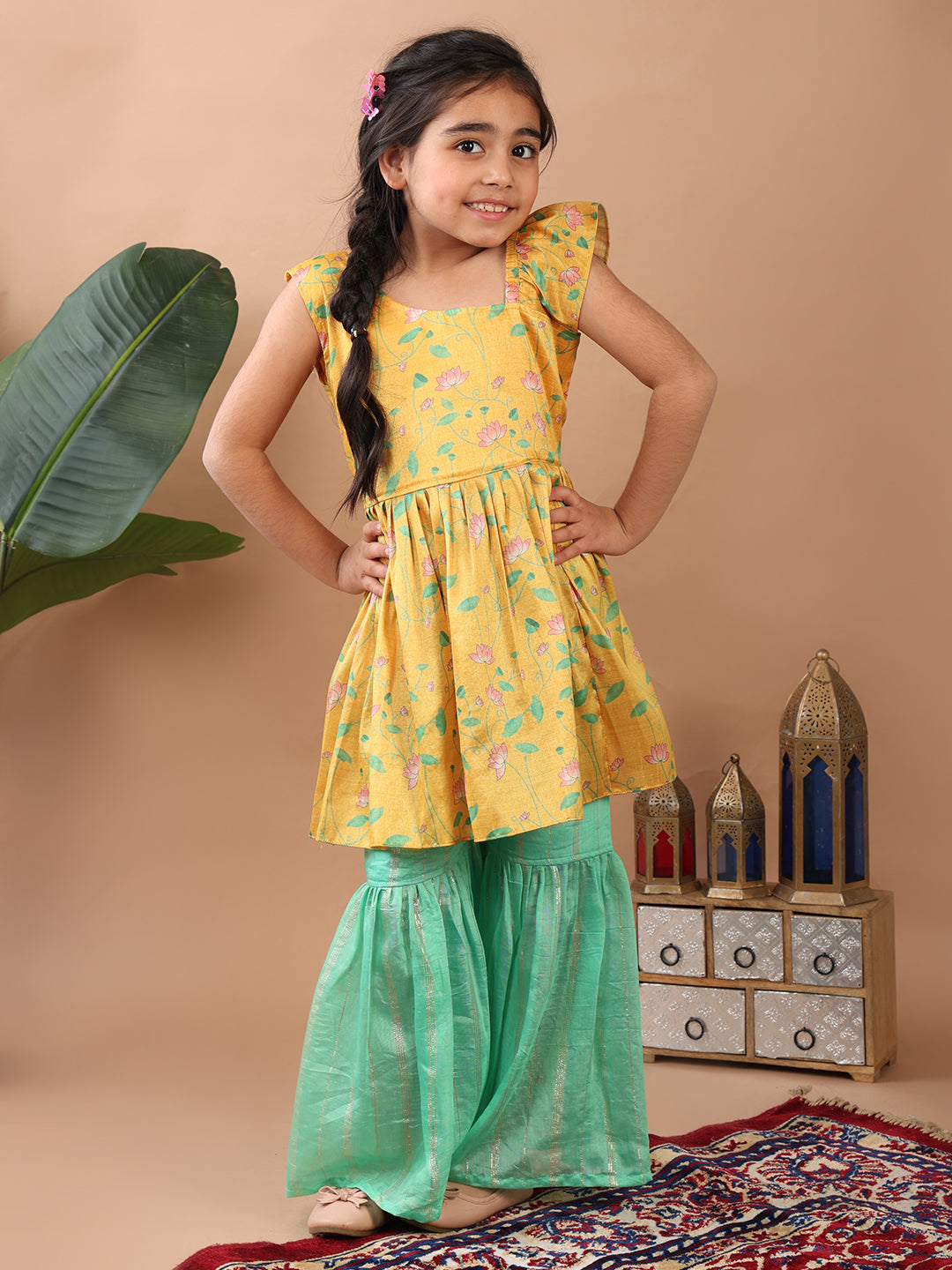 Yellow Lotus  printed sleeveless Kurti  paired with Green lurex sharara pant and dupatta