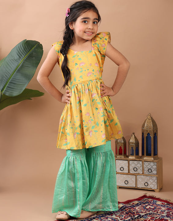 Yellow Lotus  printed sleeveless Kurti  paired with Green lurex sharara pant and dupatta