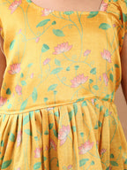 Yellow Lotus  printed sleeveless Kurti  paired with Green lurex sharara pant and dupatta