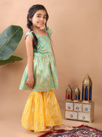 Green Lotus printed sleeveless Kurti  paired with yellow Lurex sharara pant and dupatta