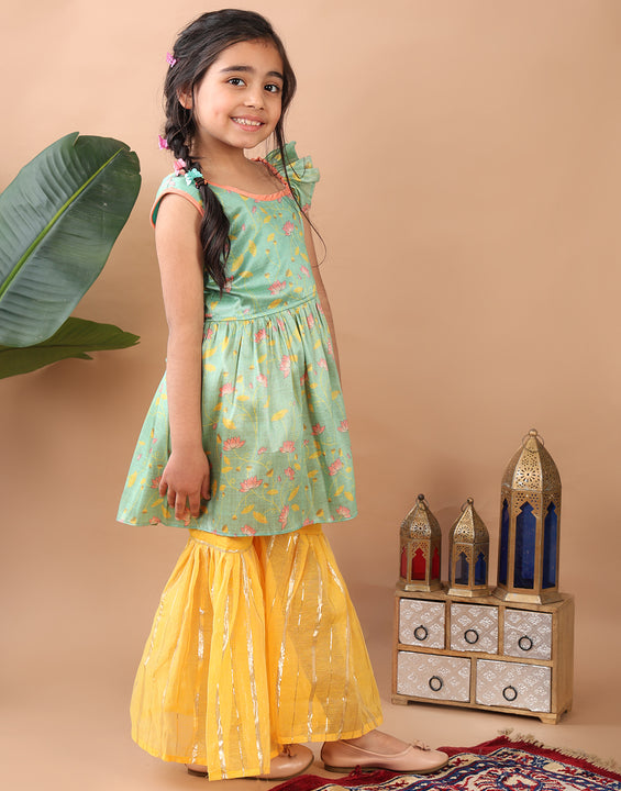 Green Lotus printed sleeveless Kurti  paired with yellow Lurex sharara pant and dupatta