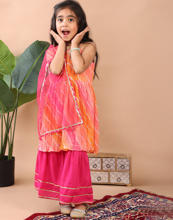 Pink Crushed Lehriya printed sleeveless Kurti  paired with pink sharara pant and dupatta