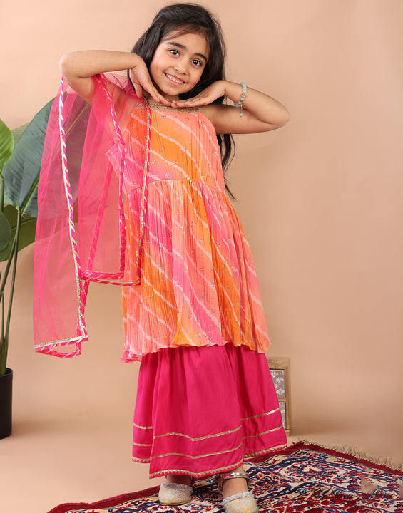 Pink Crushed Lehriya printed sleeveless Kurti  paired with pink sharara pant and dupatta