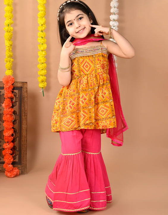 Yellow sleeveless muslin kurti with  Sharara and dupatta