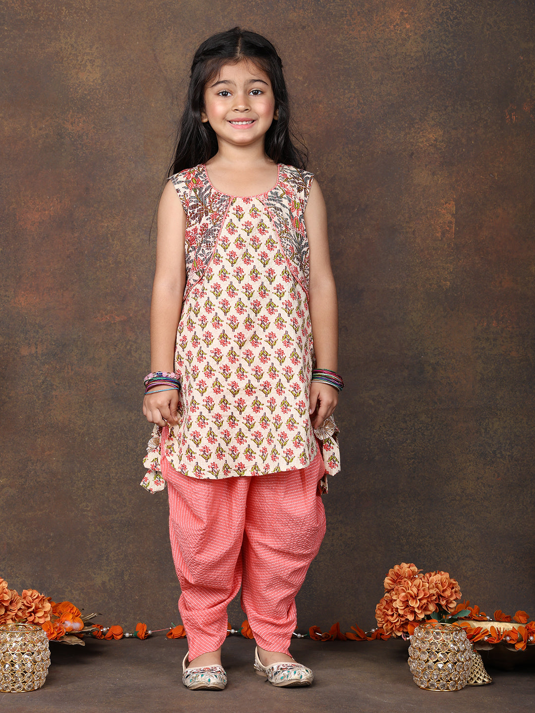 Peach Floral Printed sleeveless Kurti  paired with peach Dhoti